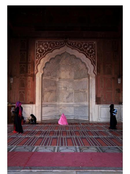 Woman praying at the Mosque